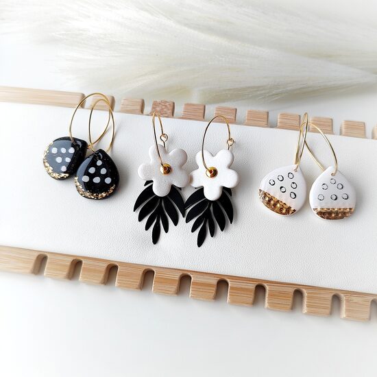 Black and white earrings with gold accents