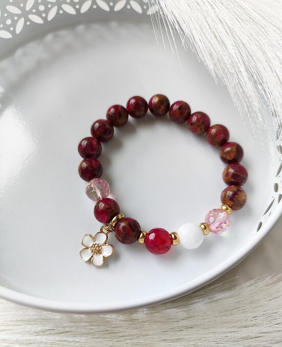 Dark pink bracelet with flower charm